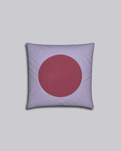 Das Kissen Red Dot auf grauem Hintergrund.