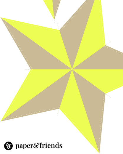 Detailaufnahme des Papiersterns auf dem Bastelbogen in Neon-Gelb und Sandbeige