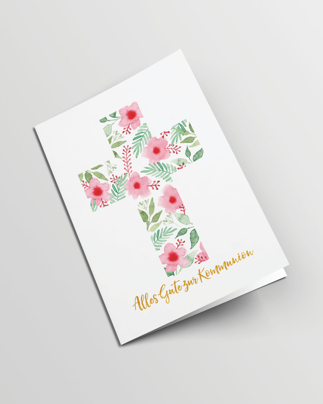 Grusskarte geschlossen. Ein Kreuz aus Aquarellblumen und -blättern auf weißem Hintergrund, darunter der Text mit Goldfolie veredelt: Alles Gute zur Kommunion.