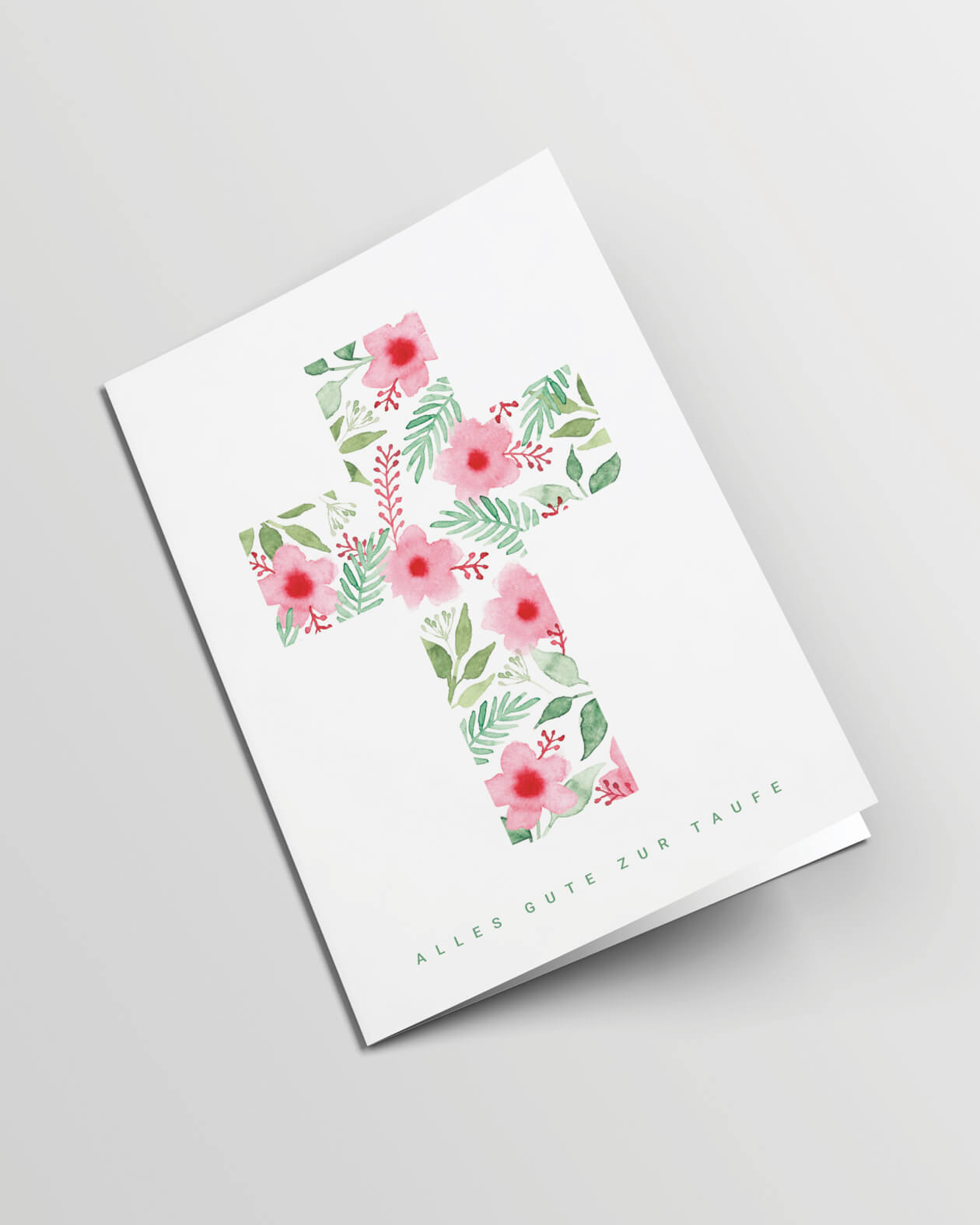 Grusskarte geschlossen. Ein Kreuz aus Aquarellblumen und -blättern auf weißem Hintergrund, darunter der Text in grün: Alles Gute zur Taufe.