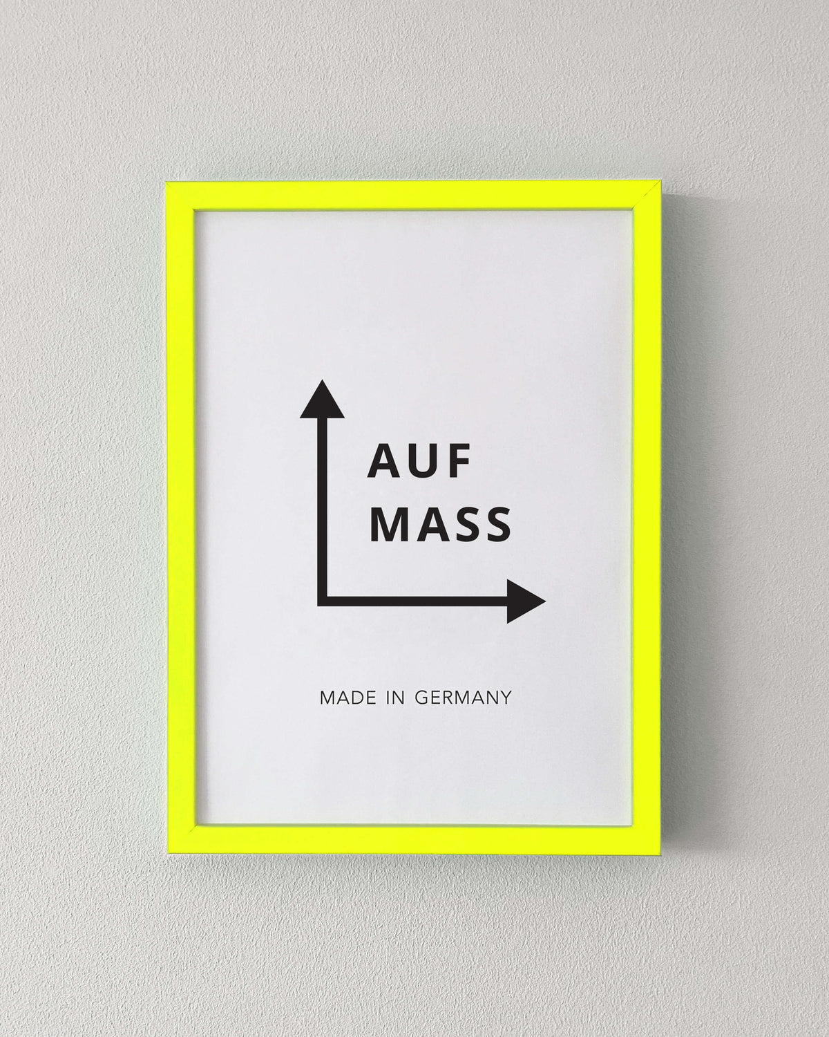 Bilderrahmen nach Maß in Neon Gelb an weißer Wand